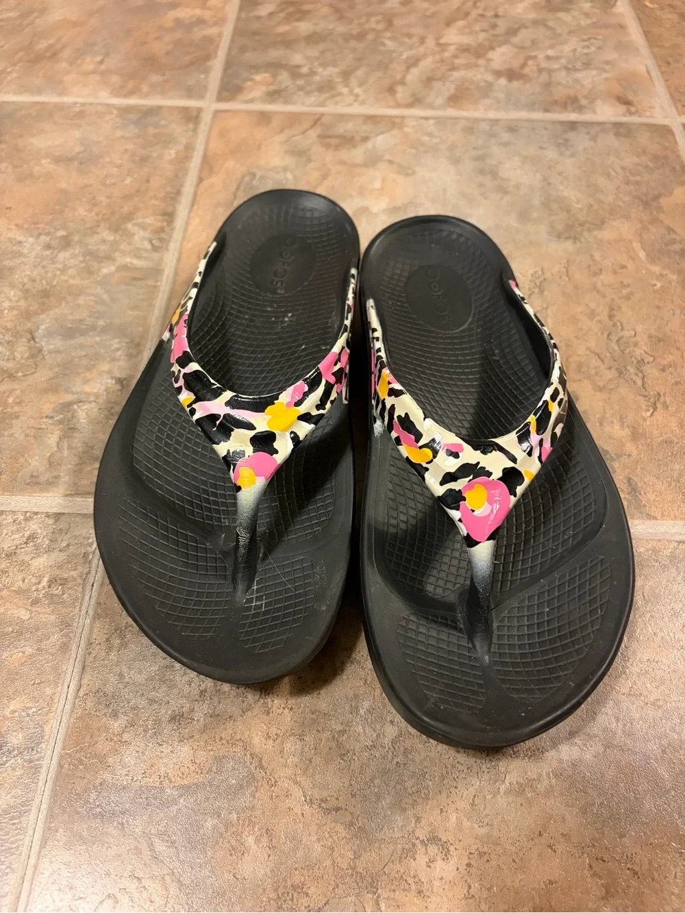 OOFOS Women's Black Flip Flop Sandals with Pink & Yellow Accent Straps